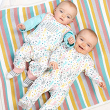 Load image into Gallery viewer, Baby in happy hare sleepsuit