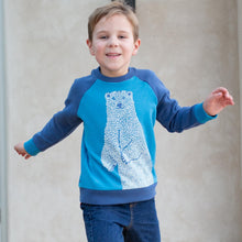 Load image into Gallery viewer, Boy in polar bear sweatshirt