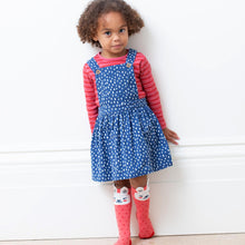 Load image into Gallery viewer, Girl in speckle heart pinafore
