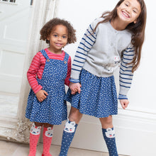 Load image into Gallery viewer, Girl in speckle heart pinafore