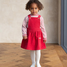 Load image into Gallery viewer, Girl in mini pocket pinafore