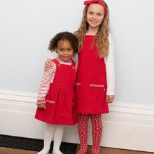 Load image into Gallery viewer, Girl in mini pocket pinafore