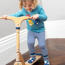 Load image into Gallery viewer, Child in mini stripy leggings